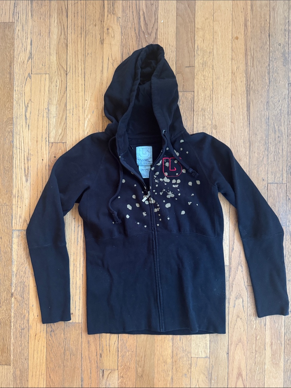 Burton Women’s Black Zip-Up Hoodie with brown Paint-Splatter Accent